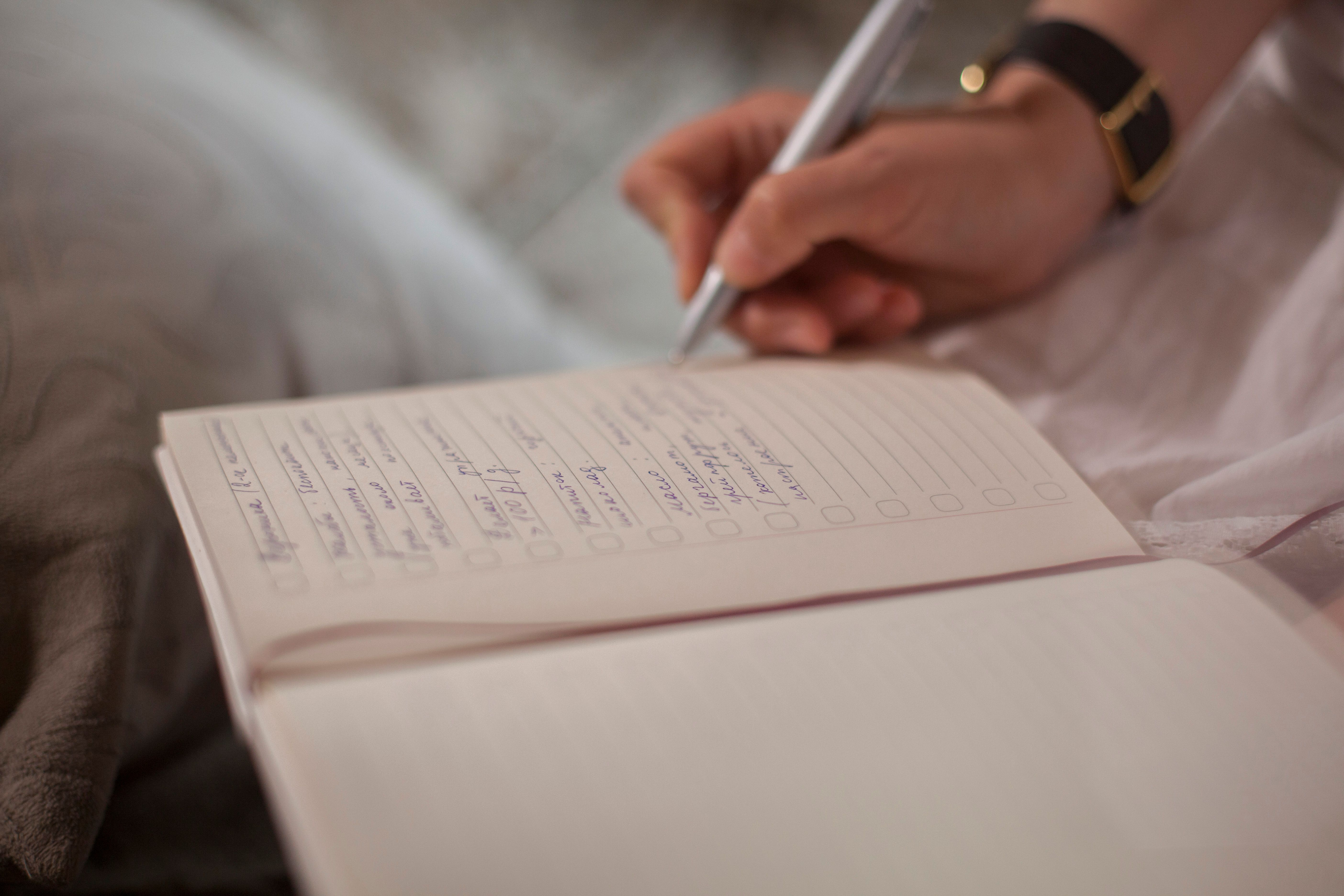 A woman writing down quotes
