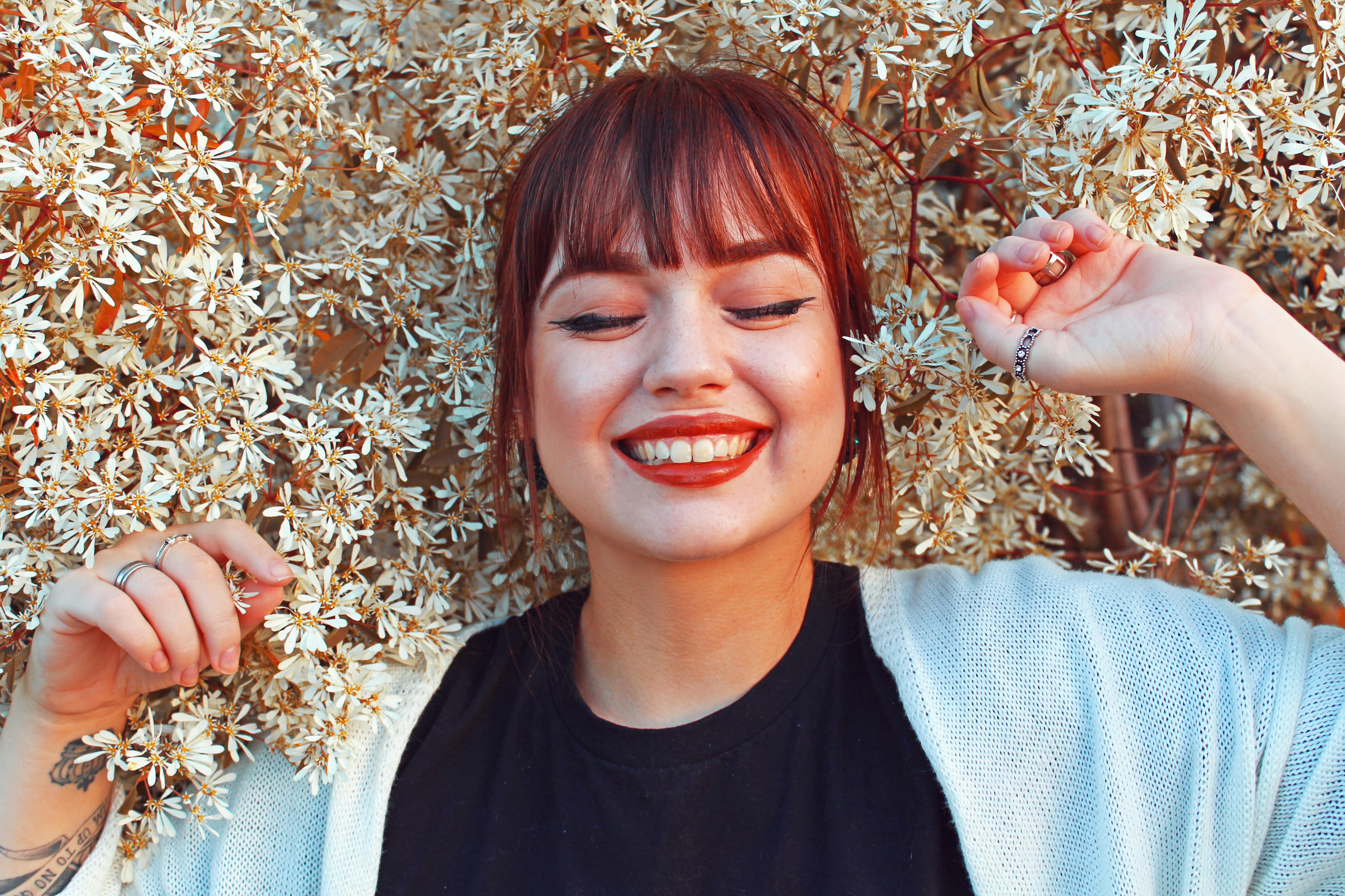 A happy woman smiling widely