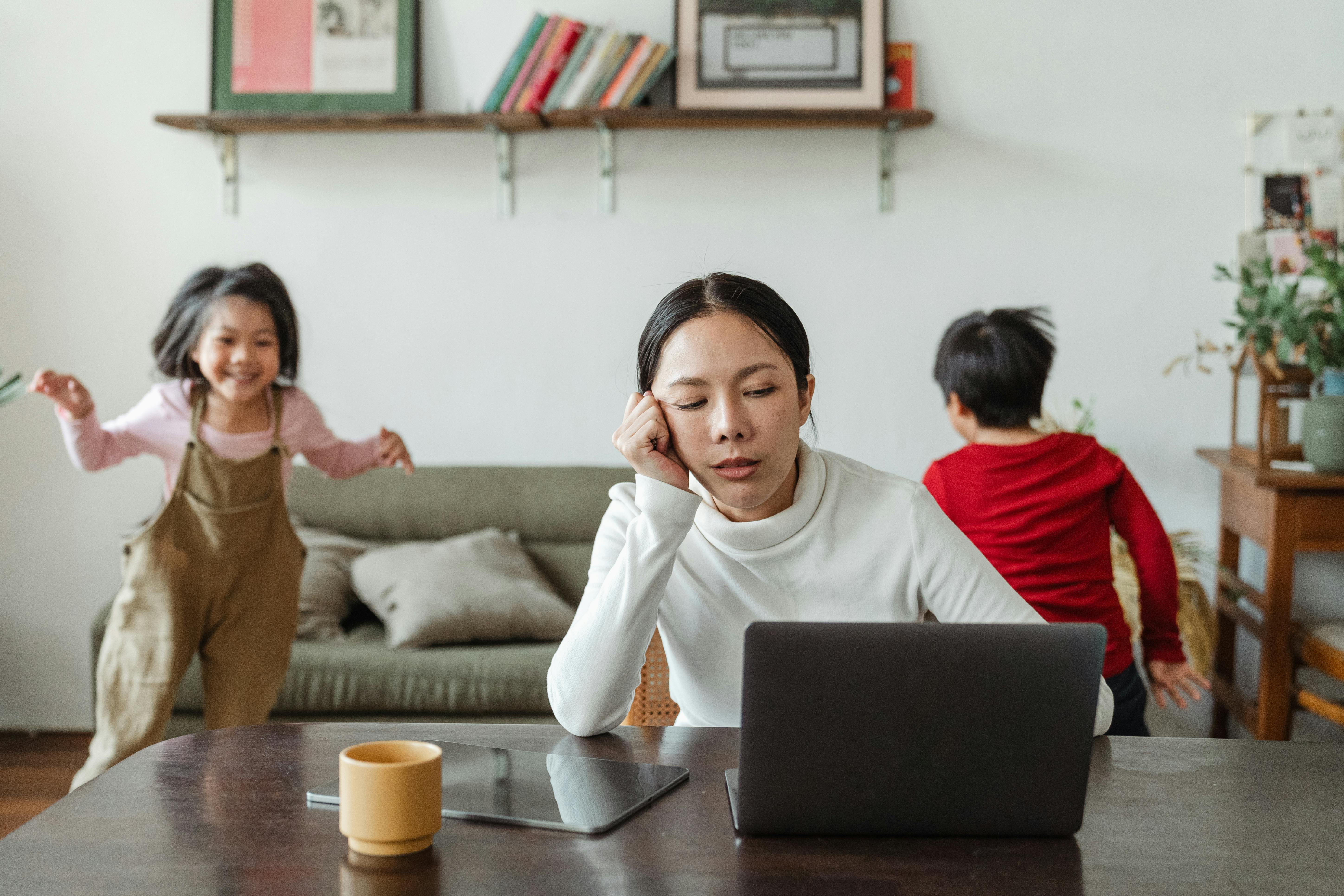 an overwhelmed young mother juggling tasks
