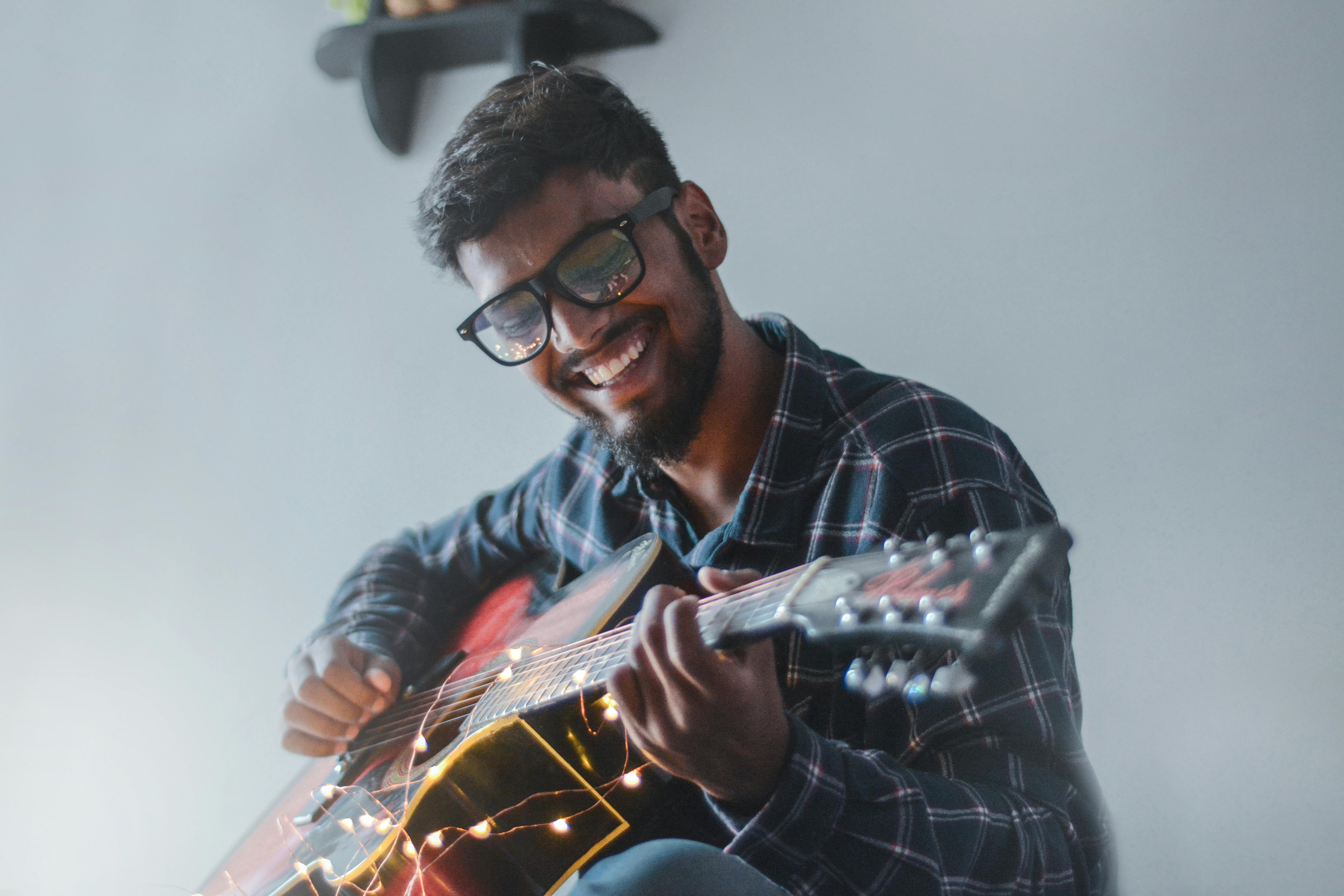 Man happily playing guitar
