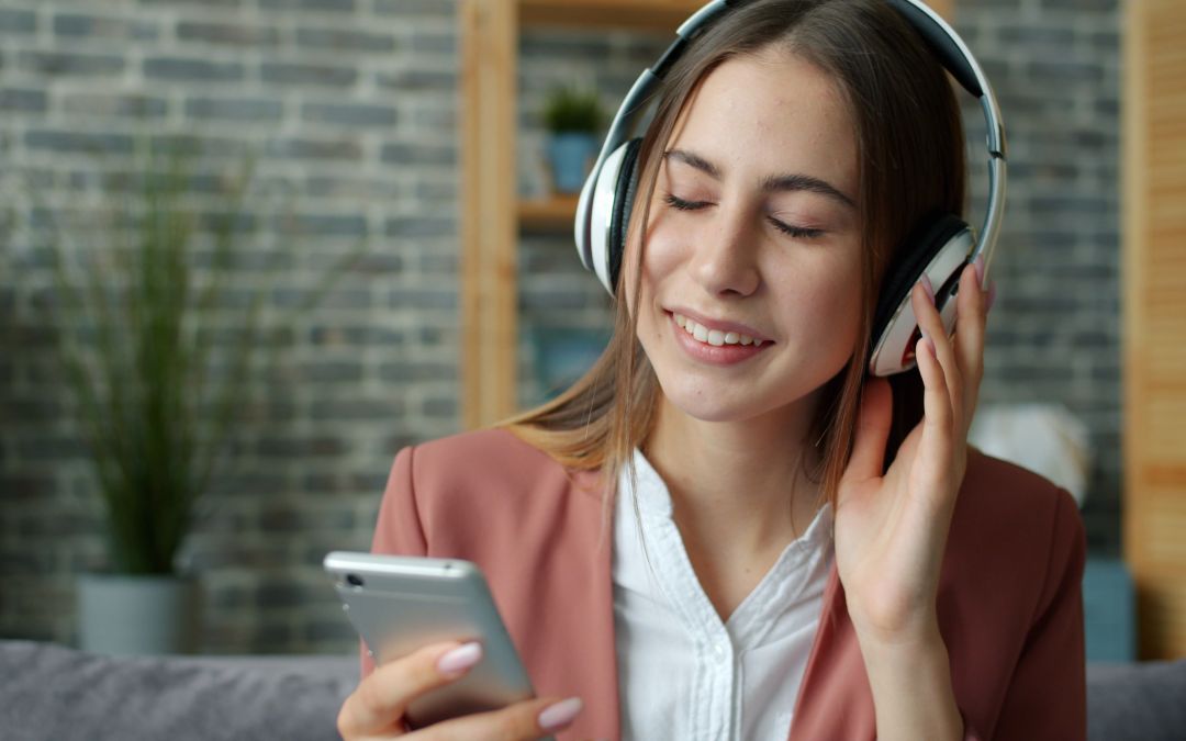 woman listening to sound frequencies with headphones